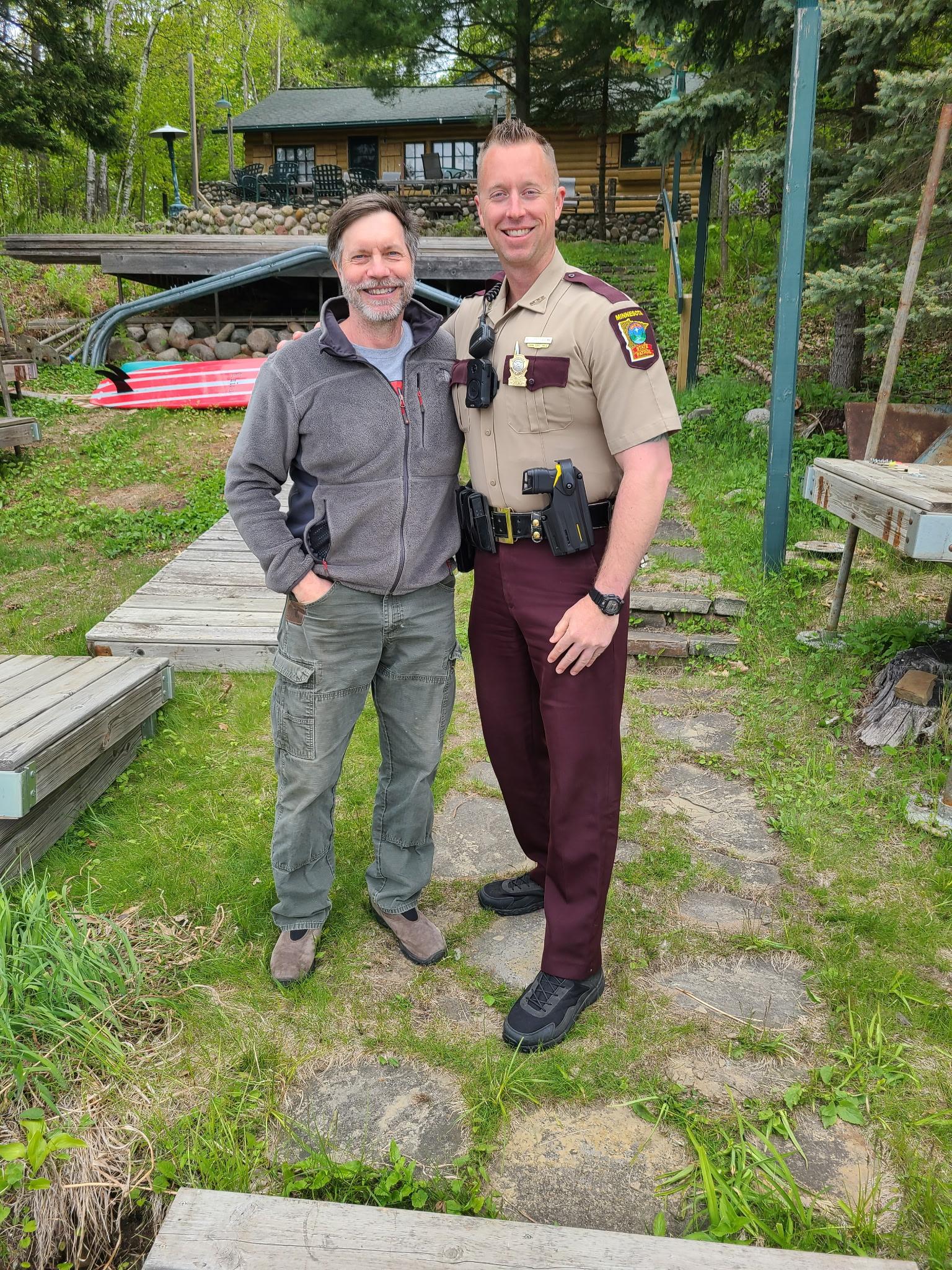 Don Weiblen and Trooper Nick Otterson pose after reunited five years after Weiblen's cardiac arrest